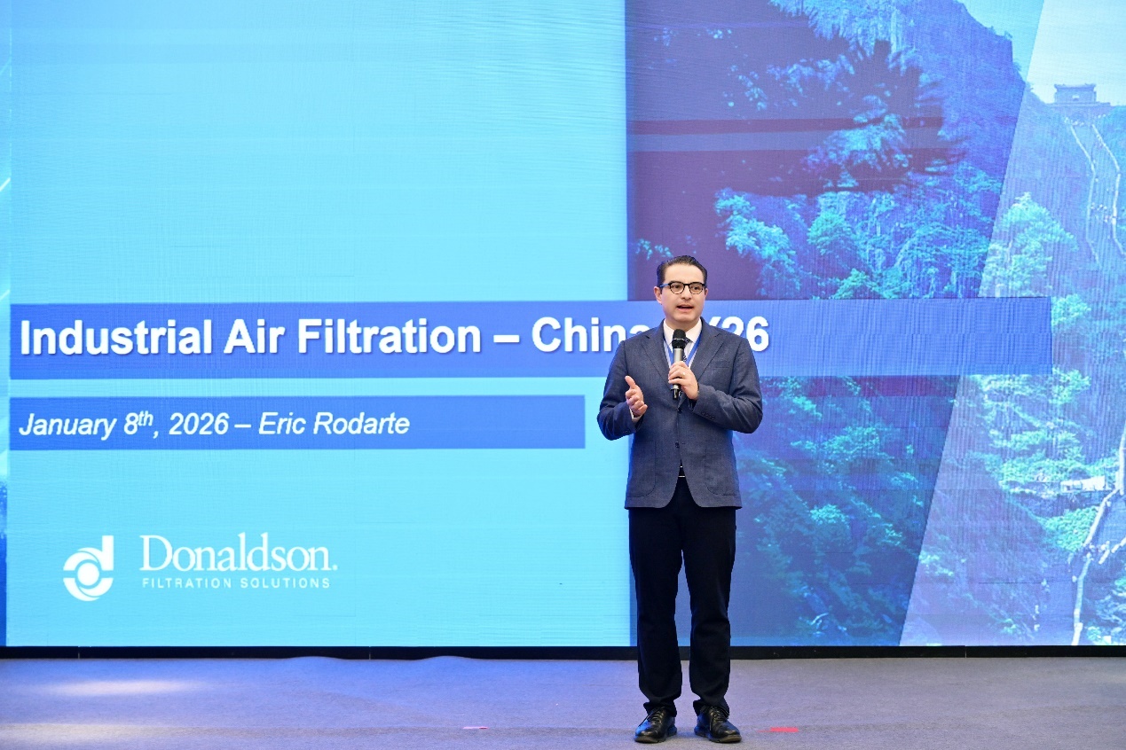 A person standing in front of a large screenAI-generated content may be incorrect.