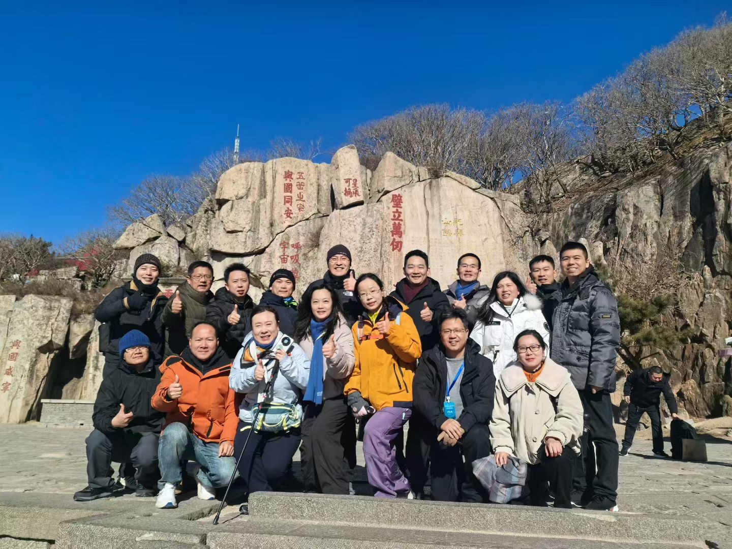 A group of people posing for a photoAI-generated content may be incorrect.